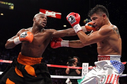 Floyd Mayweather Jr lands a left jab on Victor Ortiz. File photo by Al Bello/Getty Images/AFP