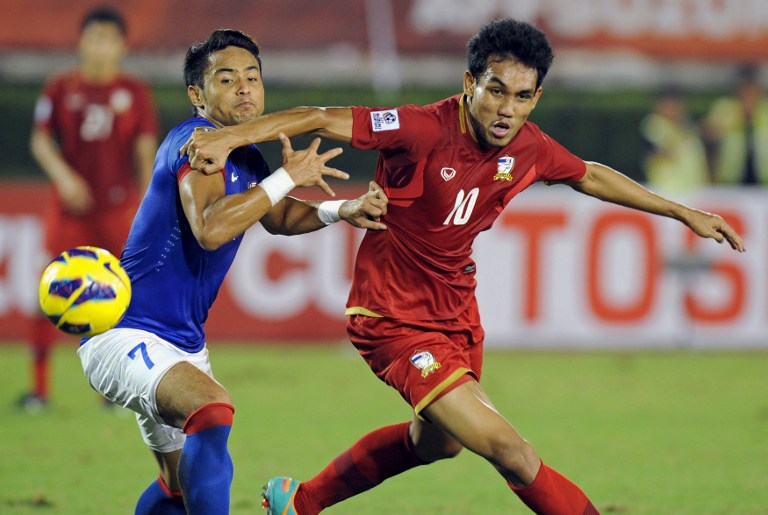 DOMINANT THAIS. Thailand advances to the finals undefeated, in large thanks to Teerasil Dangda (R) who has scored 5 of the team's 12 tournament goals. Photo by AFP.