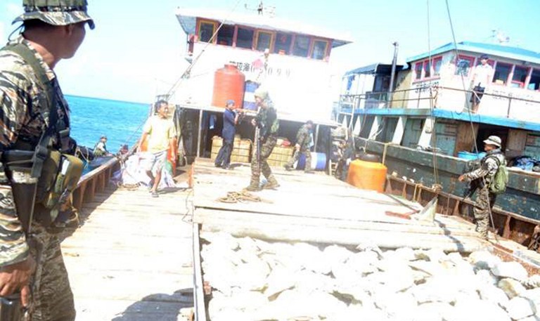 STALEMATE. Both sides agreed to back off but the dispute remains unsolved. Philippine sailors inspect on of the Chinese fishing boats which ventured into Scarborough Shoal in April. Photo courtesy of DFA