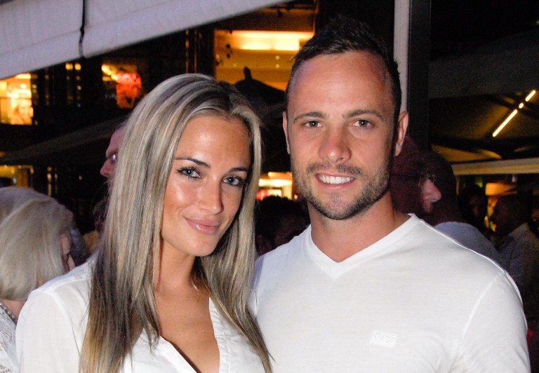 LOVE GONE WRONG. Oscar Pistorius and his model girlfriend Reeva Steenkamp pictured in happier times. Photo by AFP.