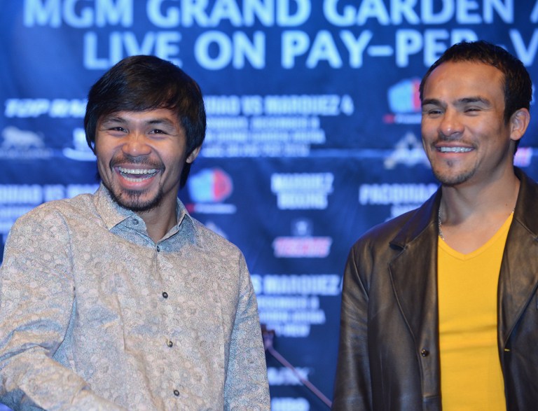 BETTER MOOD. "He's having fun with it," trainer Freddie Roach said of his prized fighter Manny Pacquiao on training for his fourth bout against Juan Manuel Marquez. File photo by AFP.