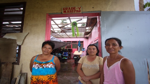 REFUGE. Without a roof, what used to be a classroom provides temporary shelter to residents who survived Typhoon Pablo. Photo by Karlos Manlupig