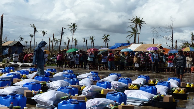 FOR DISTRIBUTION. Donated rations are lined up for the taking.