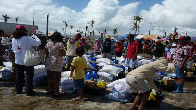 MY SHARE. Those who survived Pablo pick up their share of donations.