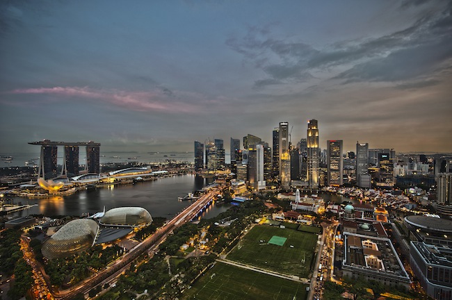 Singapore skyline at dusk, June 3, 2011. Photo courtesy of Wikipedia/chensiyuan