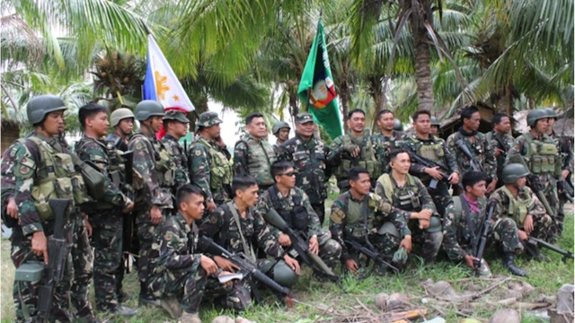 'SUCCESSFUL': The Philippine Army's 601st troopers take a group photo after successful operations to capture BIFF camps