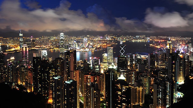 View of Hong Kong and Kowloon from Victoria Peak, 2011. Photo courtesy of Wikipedia/chensiyuan