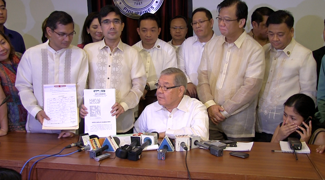 HISTORIC. In this file photo, members of the House of Representatives show their impeachment complaint against then Chief Justice Renato Corona. 