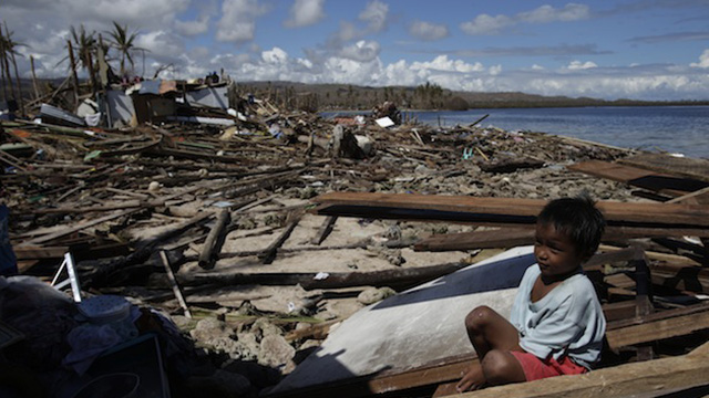 SOLACE. A child manages a smile amid the devastation. Photo by John Javellana SOLACE. A child manages a smile amid the devastation. Photo by John Javellana