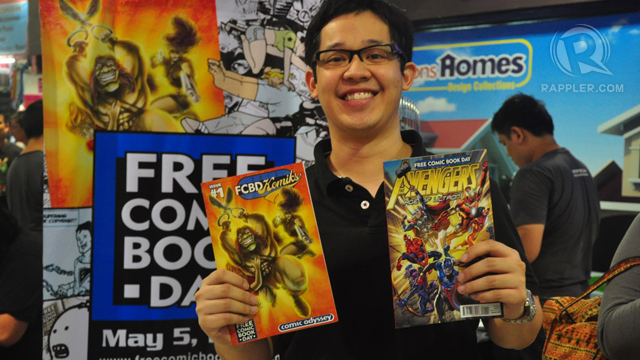 HAPPY HERO'S GRANDSON. Jiggy Cruz beams with happiness over his free comics. Photo by Jerald Uy