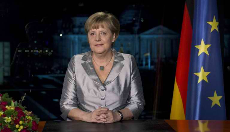German Chancellor Angela Merkel poses for photographers after the recording of her annual New Year's speech at the Chancellery in Berlin on December 30, 2012. AFP PHOTO / POOL/ JOHN MACDOUGALL