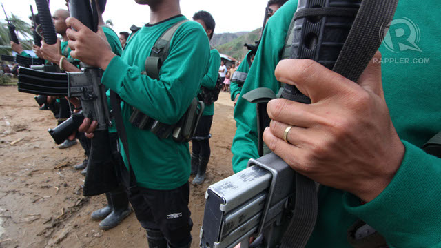 NO PERMIT NEEDED? NPA guerillas somewhere in Compostela Valley during the celebration of the 44th anniversary of the re-establishment of the Communist Party of the Philippines last Dec 26, 2012. File photo by Karlos Manlupig