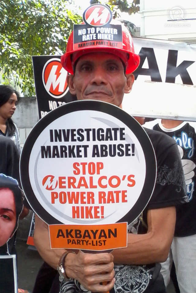 PROTEST. A protester calls on DOJ to investigate possible market abuse amid Meralco price hike. Photo by Buena Bernal/Rappler