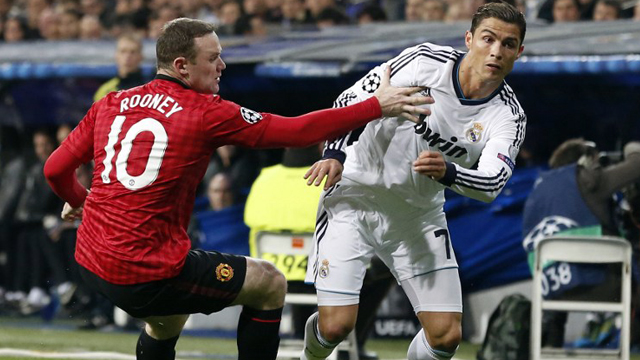 KEY MATCHUP. The Ronaldo-Rooney battle will be at the center of the Real Madrid-Manchester United last 16 match. Photo by Cesar Manso/AFP