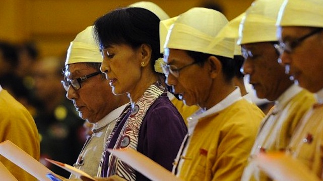 MP SUU KYI. Myanmar opposition leader Aung San Suu Kyi (2nd L) along with other elected members of parliament reads her parliamentary oath at the lower house of parliament during a session in Naypyidaw on May 2, 2012. Photo by Soe Than Win, AFP