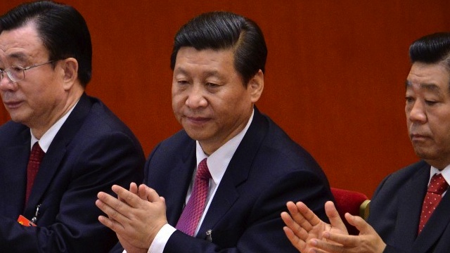 XI'S WAITING. Chinese vice president Xi Jinping (C) applauds during the closing of the 18th Communist Party Congress at the Great Hall of the People in Beijing on 14 November 2012. AFP PHOTO/WANG ZHAO