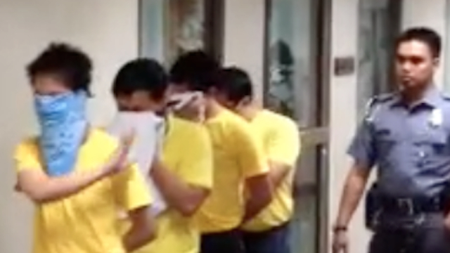 MEDIA SHY. The 4 defendants wear masks to hide their faces from the cameras when entering the courtroom and the defense wants a gag order on the press. Photo by Carlos Santamaria