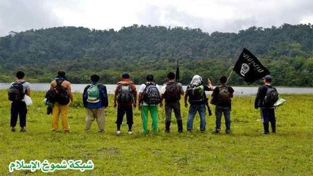 Filipinos carry the black flag in the southern Philippines