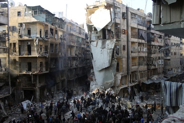 THE VIOLENCE CONTINUES. Syrians search for survivors amidst the rubble following an airstrike in the Shaar neighborhood of Aleppo on December 17, 2013. File photo by AFP/Mohammed al-Khatieb