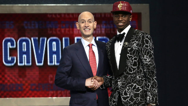 LOTTERY TICKET. Andrew Wiggins (R) was selected number one overall by the Cleveland Cavaliers despite the team having low odds of winning the top pick. File photo by Jason Szenes/EPA