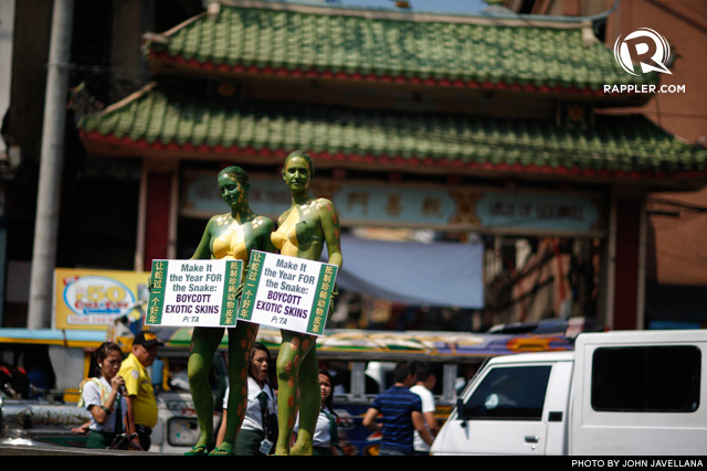 NO TO SNAKESKIN. Protesters from the People for the Ethical Treatment of Animals (PETA) in snake-themed body paint urge the boycott commercially-used snakeskin