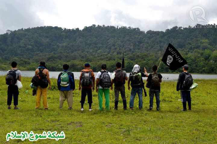 Filipinos carry the black flag in the southern Philippines