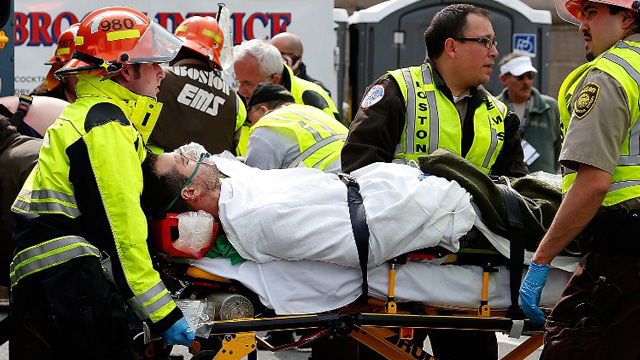 INJURED. A man is loaded into an ambulance after he was injured by one of two bombs exploded during the 117th Boston Marathon near Copley Square. AFP Photo