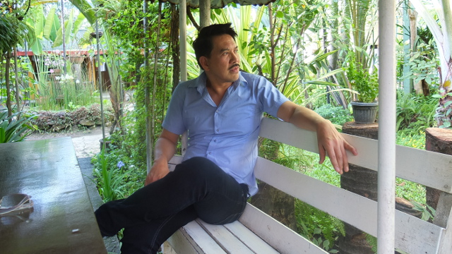 SECRET GARDEN. Brillante Mendoza takes in his large garden from the spot where he eats breakfast everyday. Photo by Pia Ranada