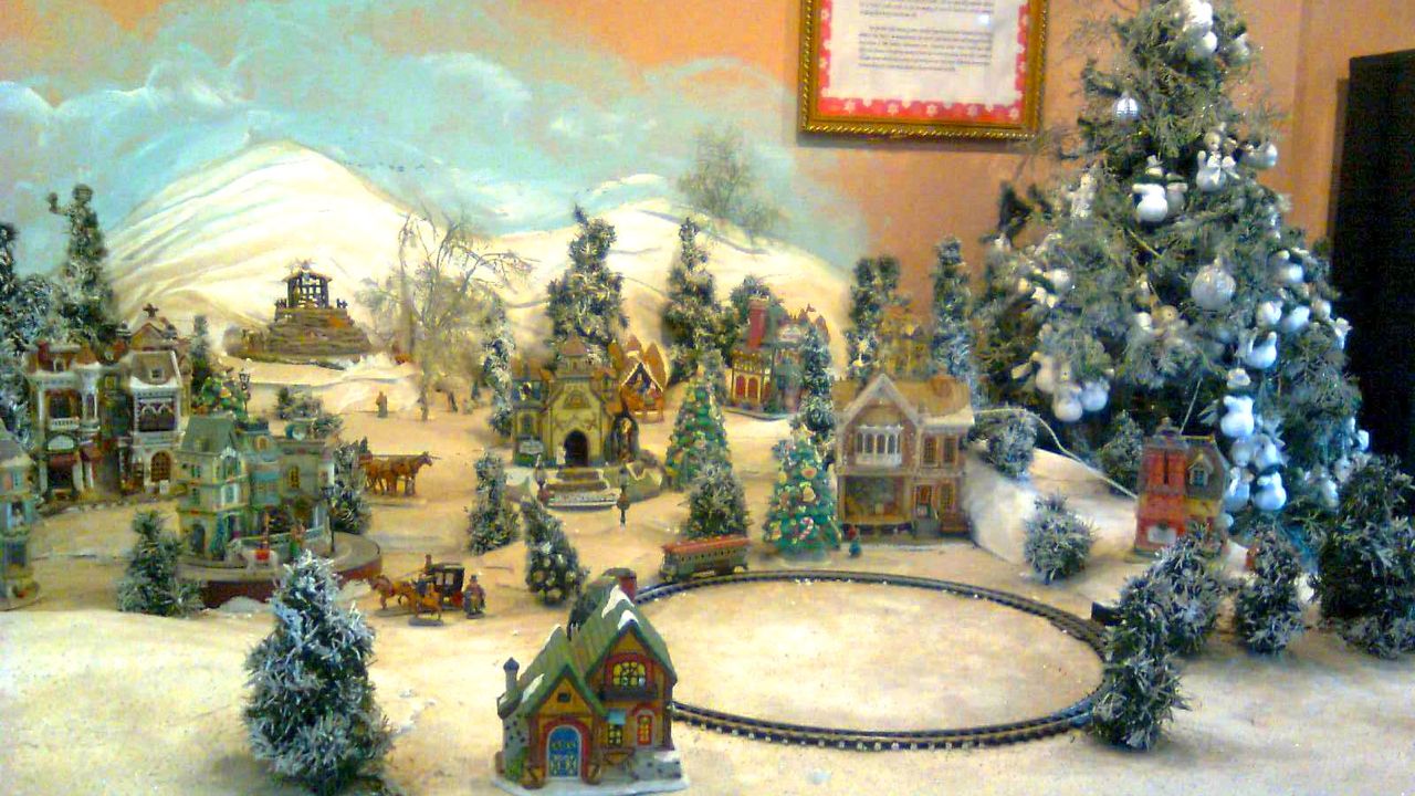 MINI VILLAGE. It is complete with a train and a railroad