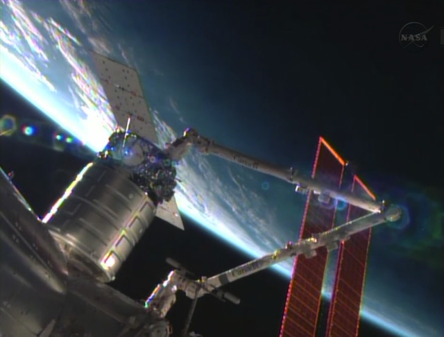 DOCKED. The Cygnus commercial resupply craft is installed by the Canadarm2 to the Harmony node. Photo courtesy NASA TV