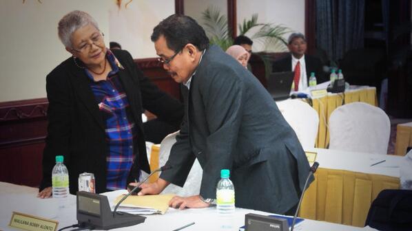 FINALLY. Office of the Presidential Adviser on the Peace Process Secretary Teresita Deles confers with MILF chief negotiator Mohagher Iqbal after the two panels come to an agreement on wealth sharing. Photo from OPAPP