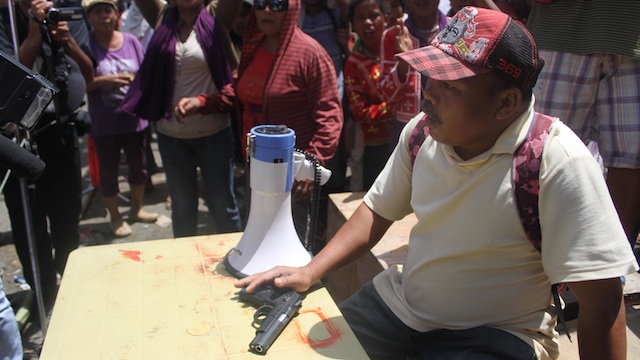 The protestors confiscated a handgun from a suspected intelligence operative