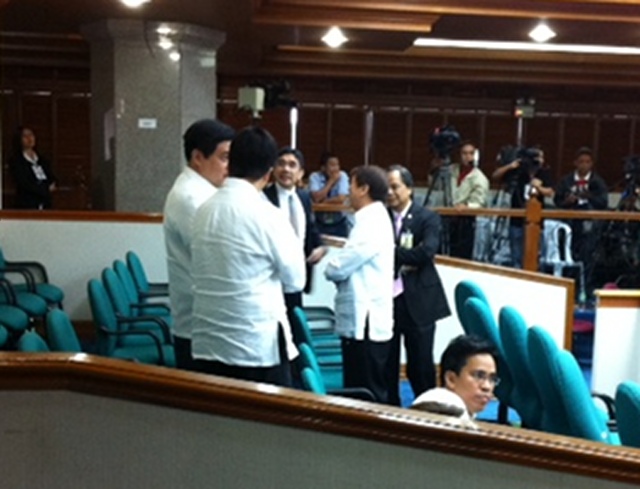 HUDDLE. Members of the prosecution huddle during a break.