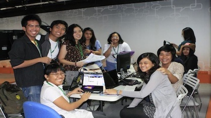 AT WORK. Writer Fritz Rodriguez, standing third from left, is flanked by co-interns.
