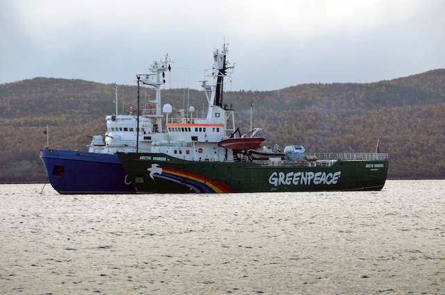 SEIZED. The seized Greenpeace ice breaker 'Arctic Sunrise' (front) is towed by a Russian Coast Guard vessel (behind) along the Kola Bay of the Barents Sea, some 40 kilometers from Murmansk, Russia, 24 September 2013. Photo by EPA/Angela Kolyada