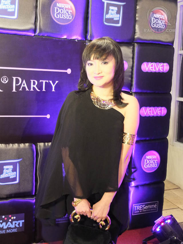 GLAMOUR GOLD. Fashion designer Kate Torralba pairs somber black with festive gold accessories