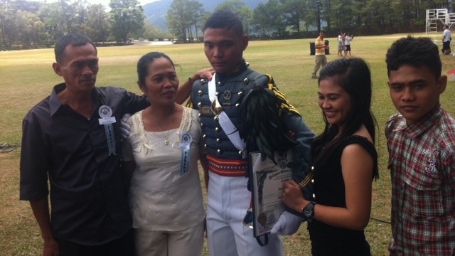 PROUD FAMILY. Jestony poses for a photo with his siblings Angeline and JP, and with his parents, a tuba gatherer and a housewife. Photo by Natashya Gutierrez.