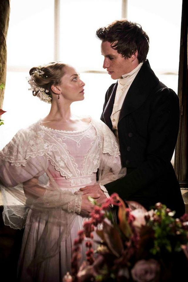Amanda Seyfried as Cosette (left) and Eddie Redmayne as Marius Pontmercy (right)