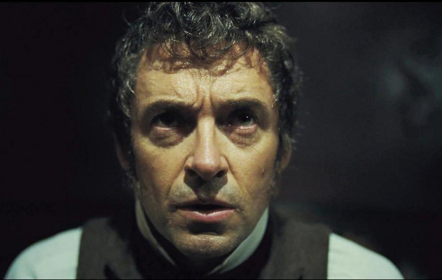 UP CLOSE AND PROFESSIONAL. Hugh Jackman is in our face and ears as beleaguered Jean Valjean
