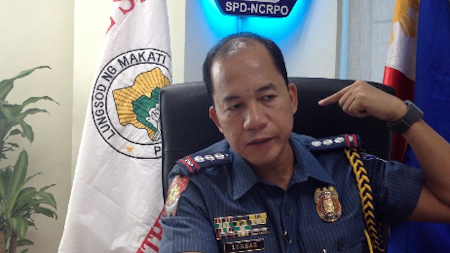 FATAL WOUND. Makati police chief Senior Supt. Manuel Lukban points to the exact spot where the victim received the fatal stab to his neck. Screenshot from video footage by Carlos Santamaria