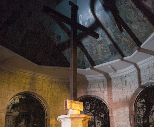 CHRIST'S CROSS. The Magellan’s cross is littered with candles left by devotees after performing a prayer dance. Photo by Jon Cabiles