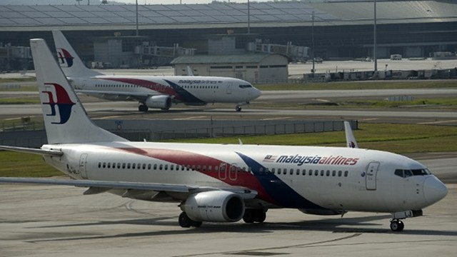 Malaysia airlines planes are seen on the tarmac at the Kuala Lumpur International Airport in Sepang on July 18, 2014. Photo by Nicolas Asfouri/AFP