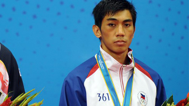 UFC fighter Mark Eddiva accepting his bronze medal at the Asian Games in 2010. File photo by Laurent Fievet/AFP 