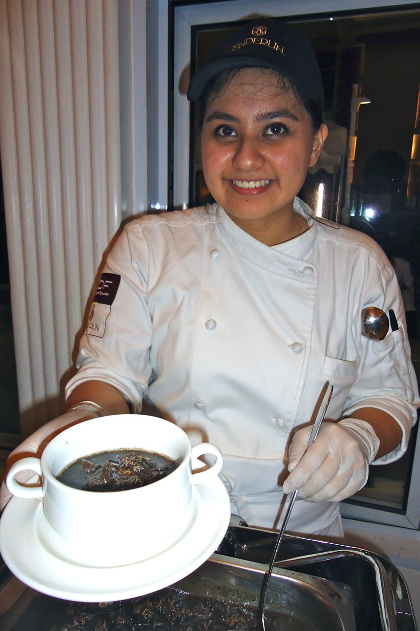 MOST REQUESTED DISH. A member of the Kawali Kings serving Nana Meng's dinuguan