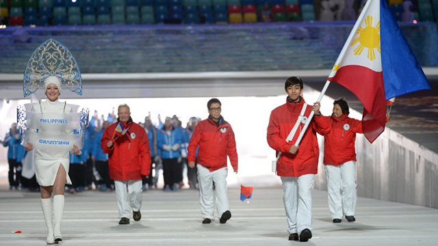 Martinez carries the Philippine flag during last Friday's opening ceremony. Photo by Andrej Isakovic/AFP