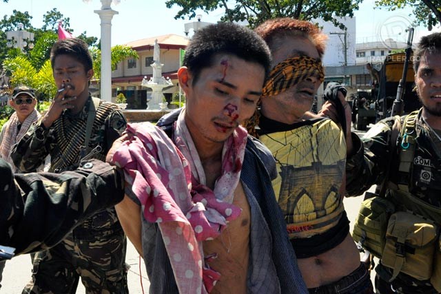 ARRESTED: Military arrests 2 MNLF fighters on Day 8 of crisis. Photo by LeAnne Jazul