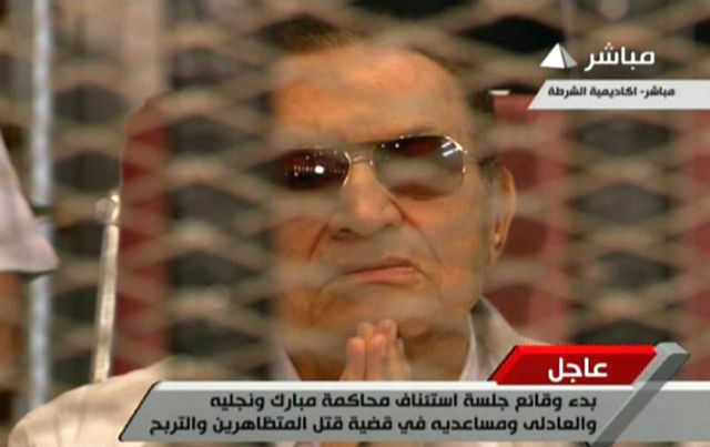HOSNI MUBARAK. An image grab taken from Egyptian state TV shows the ousted Egyptian president gesturing behind bars during a hearing in his retrial at the police academy in Cairo. Photo by AFP/Egyptian TV