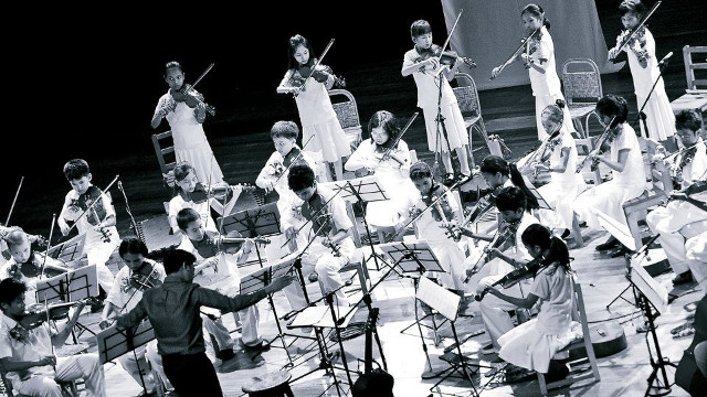 ONE MORE TIME ON MARCH 10. Ford Pundamiera conducts the Kolisko Waldorf School Ensemble. Photo by Andrew Querouz
