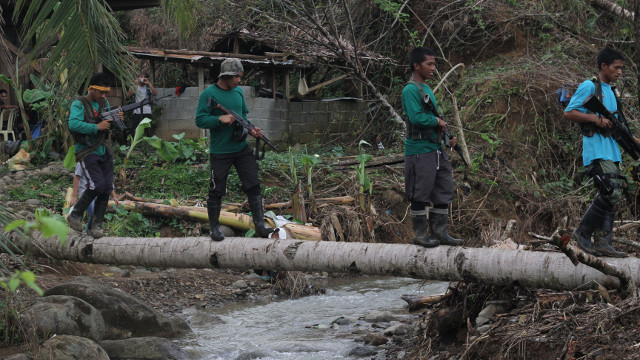 BAILIWICK. Rebels in their camp in Compostela Valley. File photo by Karlos Manlupig BAILIWICK. Rebels in their camp in Compostela Valley. File photo by Karlos Manlupig