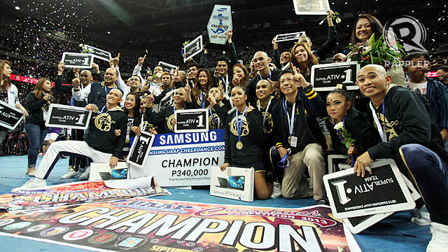 DEFENDING CHAMPS. National University celebrates after winning the 2013 Cheerdance competition. Photo by Rappler/Josh Albelda.